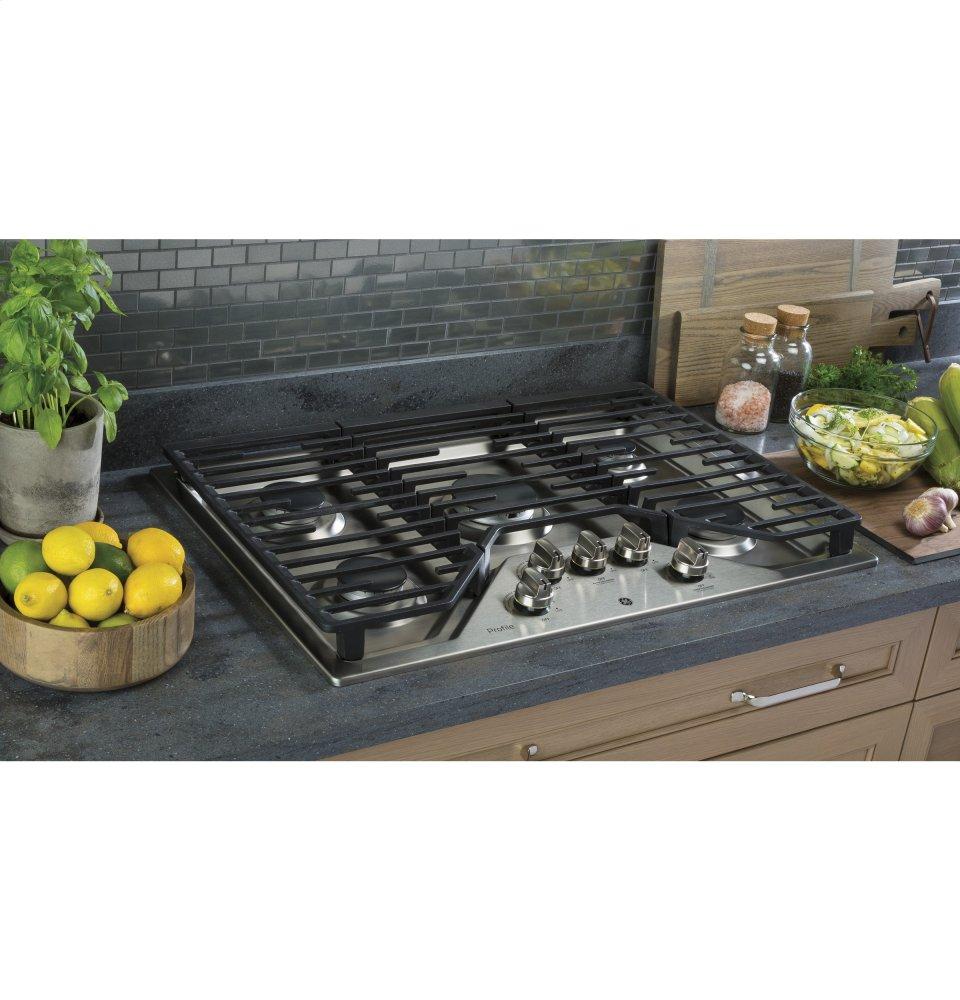 Ge Appliances PGP7030SLSS Ge Profile™ 30" Built-In Gas Cooktop With 5 Burners And Optional Extra-Large Cast Iron Griddle